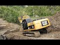 Excavator Working Moving Dirt Under The Bridge CAT 320D