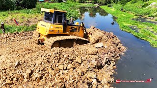 Skillful Shantui DH17c2 Bulldozer Operators are Building Road Foundation And Dump Truck Dumping Soil