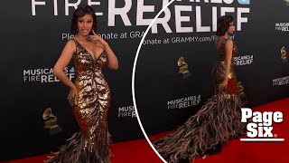 Cardi B walks on the wild side on Grammys 2025 red carpet in tiger-striped gown