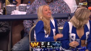 Ain't that a kick in the head: Cowboys cheerleader takes a football to the back of hers, laughs it o