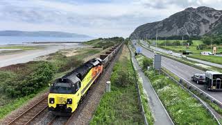 Colas' 70809 approaches Penmaenmawr quarry, with stone empties from Longport, Wednesday, 15 May 2024