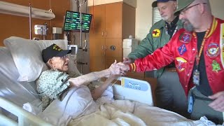 Legacy Salmon Creek employee honors patients who have served with American flags, certificates of