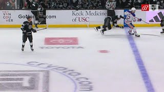 Raphael Lavoie runs into Adrian Kempe coming off the bench.