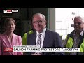 angry salmon farm protestors target albanese in hobart