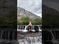 lotus in the falls graceful yoga pose on a waterfall lotuspose waterfallyoga gracefulyoga