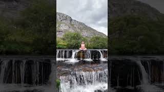 Lotus in the Falls: Graceful Yoga Pose on a Waterfall #lotuspose #waterfallyoga #gracefulyoga