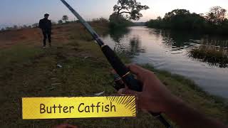 Fishing for Butter Catfish with a metal spoon.