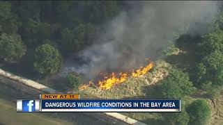 Firefighters work to put out brush fire near Hillsborough County Sheriff's Office training facility