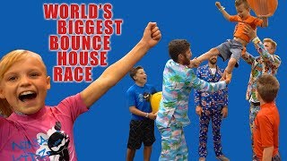 Worlds BIGGEST Bounce House Race! Ninja Kidz Tv