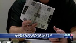 Cabell County Sheriff's deputies hand out resource guides in community