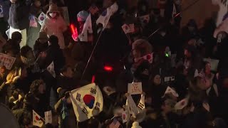 Crowds of supporters gather outside the residence of impeached South Korean President Yoon