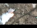 russian soldiers catch fire as ukrainian drones drop bombs on foxholes