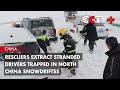 Rescuers Extract Stranded Drivers Trapped in North China Snowdriftss