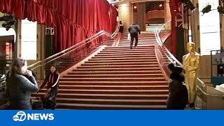 Lights, camera, rain: A soggy start with new carpet color marks 95th Oscars in Hollywood
