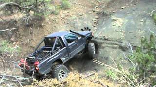 Isuzu rock crawler  pickup climbing a ledge. Judgment Bowl