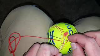 Re-lacing a softball after embroidery