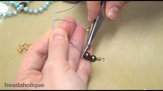 Pearl Knotting Using Tweezers