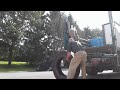 manual labor truck tire stacking