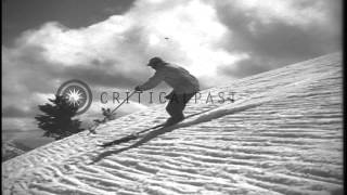 Men sliding downhill and demonstrating the stem turn in the United States. HD Stock Footage