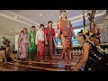 tourists trying out the bamboo dance of sabah