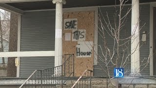 Neighbors rally to save house