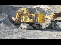 Komatsu PC 4000 face showel excavator loading Chinese XCMG XDE260 truck Awesome Machines