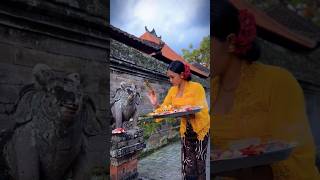 A Balinese Hindu girl performs routine rituals and...