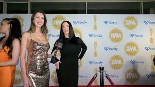 Model Ellie interviews Model Angela at XMA in Hollywood CA on the red carpet