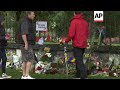 tributes left at park for nz victims church service