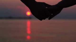 Couple Holding Hands At Sunset Stock Video
