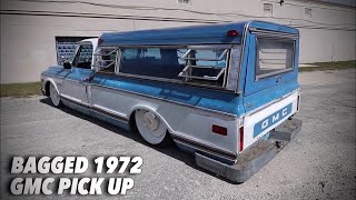 Bagged 1972 GMC truck with Detroit Steel Wheels and camper top