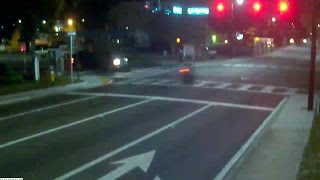 Red light camera records close call between motorcycle and SUV