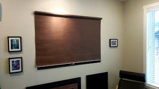 Voice-activated roller blind over TV