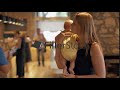 mum with baby reading menu signboard in cafe