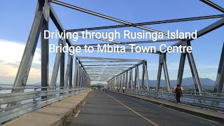 Drive through Rusinga Island Bridge to Mbita Town Centre