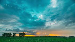 Rain Rainy Clouds Above Countryside Rural Field Landscape With Young Green Wheat Sprouts In Summer