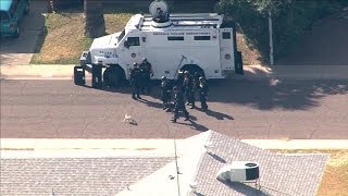 Pug picks fight with police dog outside Phoenix barricade