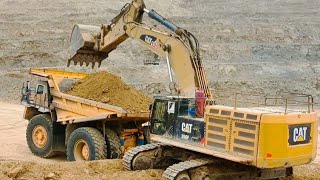 Watch with pleasure the endless efforts of the caterpillar excavator to dig the mine