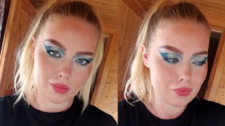 Blue makeup with graphic liner.