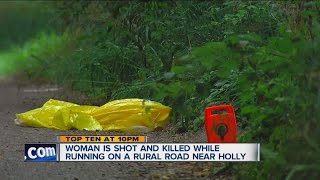 Woman shot and killed while jogging near Holly