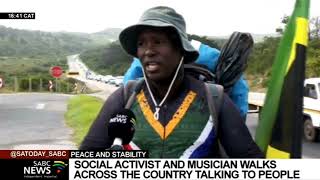 Social activist and musician walks across the country talking with people about peace and stability