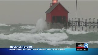 Large waves close piers, draw crowds