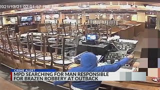Armed suspect robs Outback Steakhouse on video