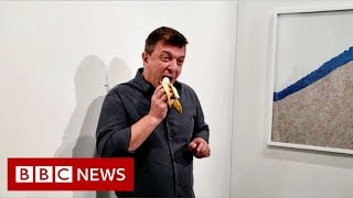 David Datuna: Artist eats $120,000 banana art at gallery - BBC News