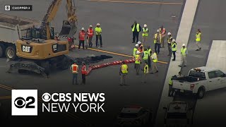 Re-opening of LaGuardia runway delayed again as crews make repairs to sinkhole