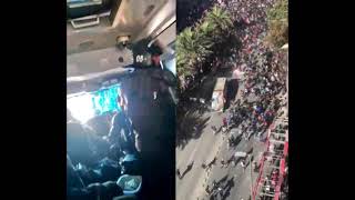 Chilean protestors attacking an armored vehicle