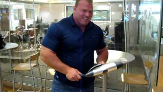 Derek Poundstone rolls a frying pan