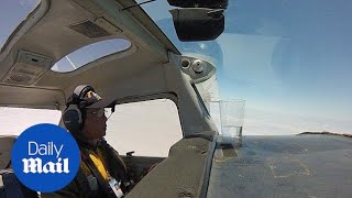 Pilot successfully performs barrel roll without spilling water