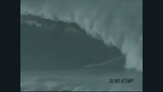 THERE IS A PERSON SURFING THAT HUGE WAVE