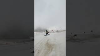 Tommy skiing into the clouds